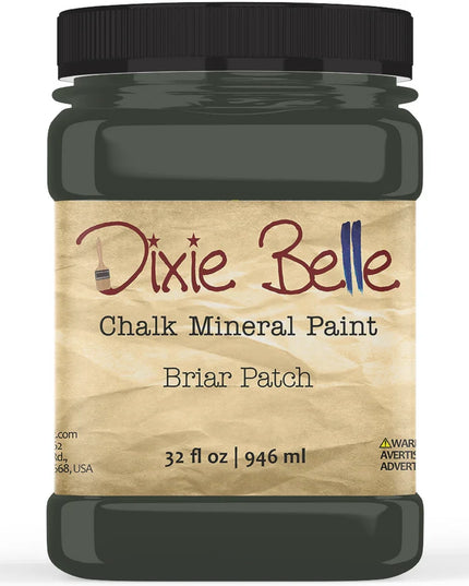A jar of Dixie Belle Chalk Mineral Paint in the Briar Patch color, featuring a black lid and a beige label, shown on a white background.
