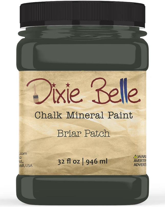 A jar of Dixie Belle Chalk Mineral Paint in the Briar Patch color, featuring a black lid and a beige label, shown on a white background.