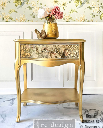 Gold side table with decorative items against a floral wallpapered wall Redesign With Prima Chapelle royale