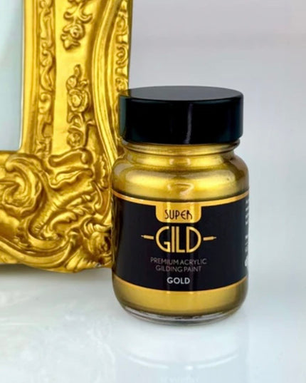 Super Gild gold acrylic gilding paint jar with a decorative gold frame in the background.