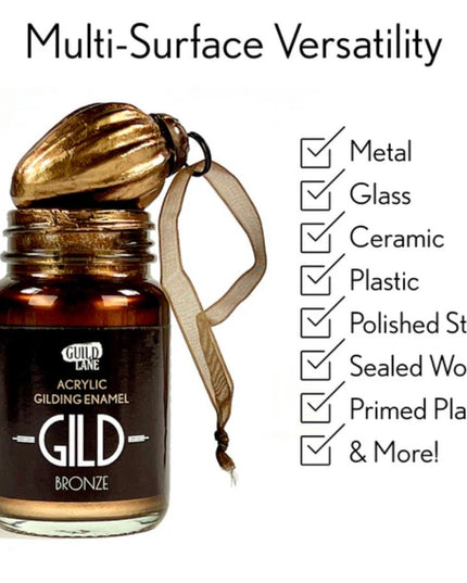Bottle of Gild bronze acrylic gilding enamel with a gold leaf on a white background, featuring text about multi-surface versatility.
