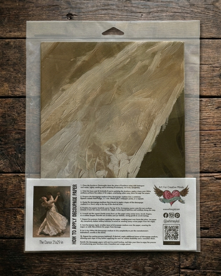 A packaged sheet of Whimsykel Decoupage paper The Dance depicting a romantic couple ball room dancing under a chandelier.