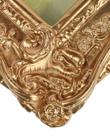 Close-up of an ornate frame panted with Guild Lane Bronze Gilding Enamel