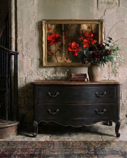An image of red flowers above a painted vintage chest of drawers