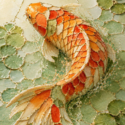A close-up of a koi fish artwork with orange, red, cream, and gold tones swimming over a green lily-pad background.