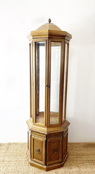 Wooden display cabinet with glass panels on a white background